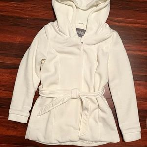 White jacket/trench coat/puffer jacket.